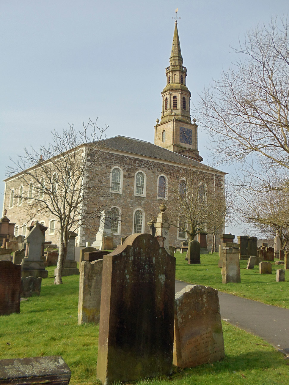 Cochrane family gravestone in Irvine Old Parish Churchyard (3690 KB) 19 March 2015 This view of the gravestone for Andrew Cochrane, Mary (Jaffrey) Simpson, and Ann (Simpson) Cochrane — the headstone in the front center foreground — shows its location within Irvine Old Parish Churchyard and includes a nice view of the church in the background. Irvine, North Ayrshire, Scotland. Photo taken 19 March 2015 by William Kerr; used by permission. For other Irvine Churchyard inquiries, please contact local historian William Kerr (bkstinan@msn.com), founder of the Irvine Kirkyard Preservation Group. (Click on Picture to View Full Size) picture