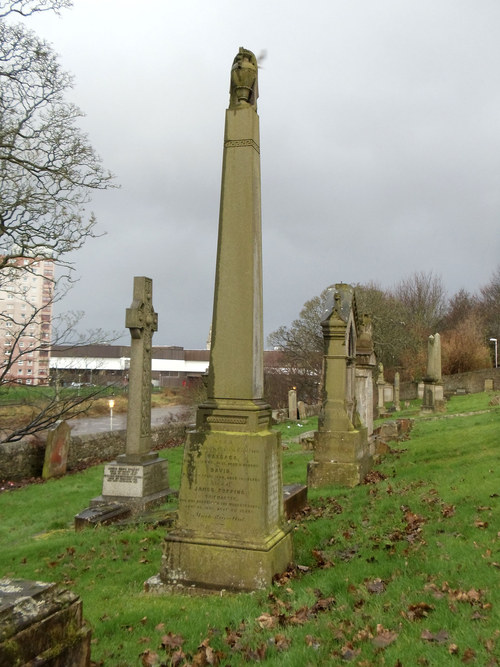 Side B of the David Topping and Mary Boyd family obelisk in Irvine Kirkyard (gravestone U46). The inscription on this panel is nearly identical to the inscription on the children's memorial (another gravestone in the churchyard). (10251 KB) 7 December 2014 Photo taken by William Kerr; used by permission. For other Irvine Churchyard inquiries, please contact local historian William Kerr (bkstinan@msn.com), founder of the Irvine Kirkyard Preservation Group. (Click on Picture to View Full Size) picture
